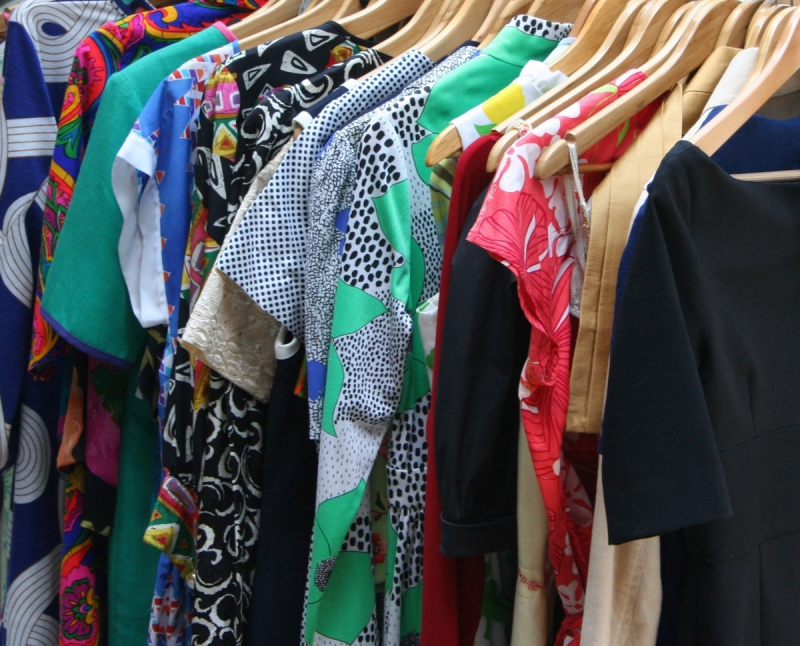 association-CORRENS-min_dresses_apparel_clothing_clothes_clothes_hangers_wooden_hangers_retail_shop_closet-1149845